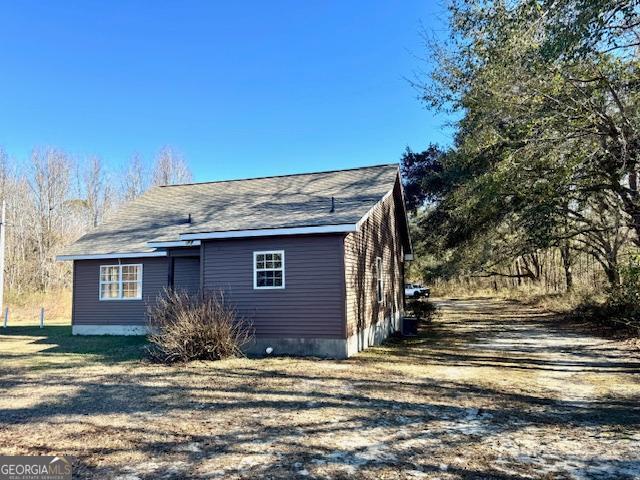 983 Johnny Brannen Road Statesboro, GA 30458 - Photo 21 of 27 a view of a house with a yard
