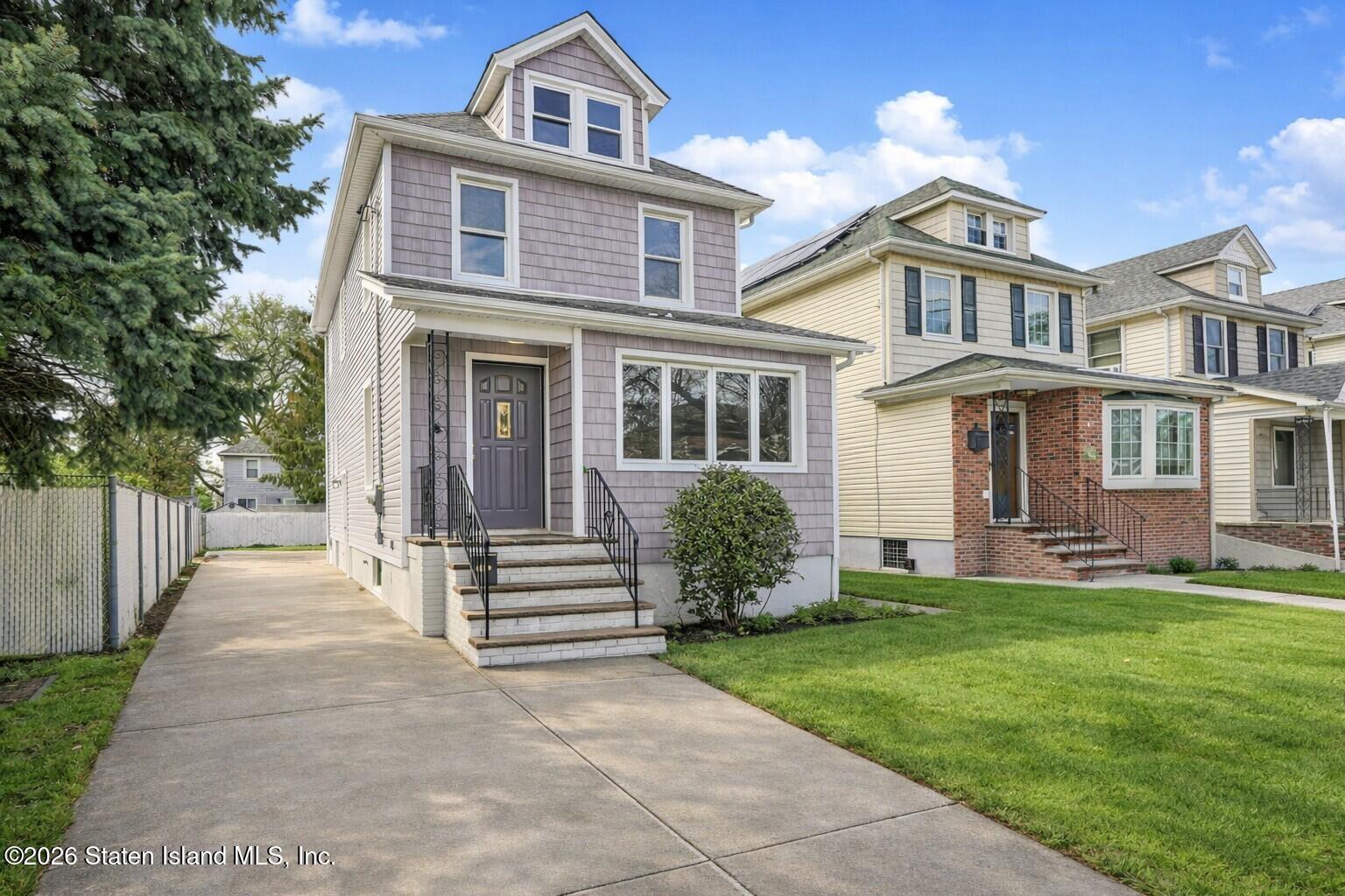 332 Willowbrook Road Staten Island, NY 10314 - Photo 2 of 17 front view of a house with a yard