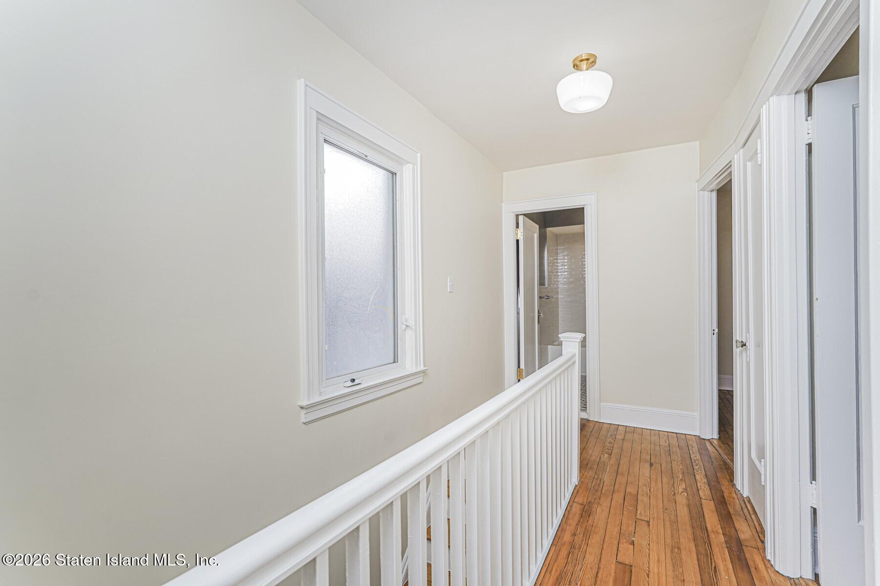 332 Willowbrook Road Staten Island, NY 10314 - Photo 9 of 17 a view of a hallway with wooden floor and entryway