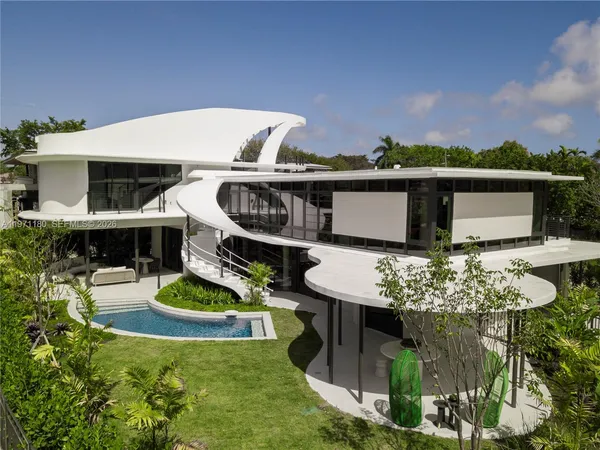 a terrace with outdoor seating and city view