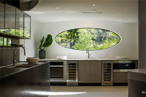 a kitchen with a stove and a microwave
