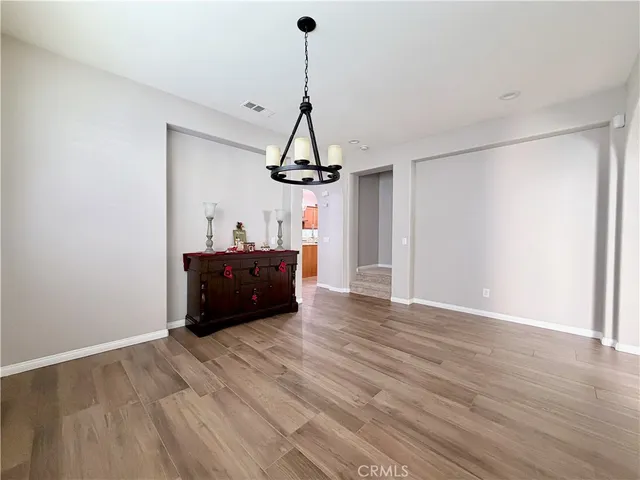 a kitchen with stainless steel appliances granite countertop a stove and a refrigerator