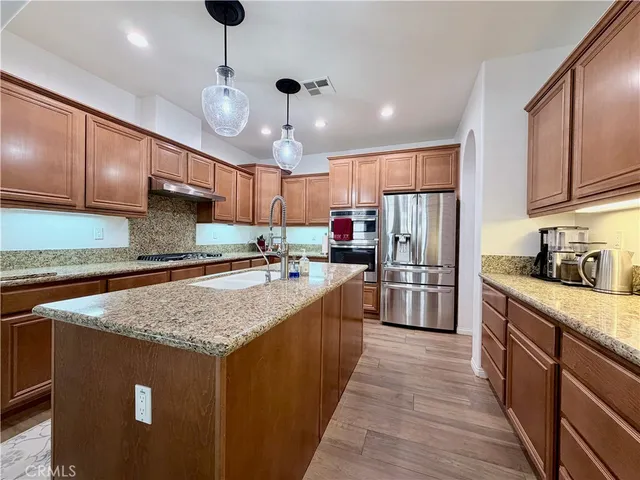 a living room with baby crib furniture and a dresser