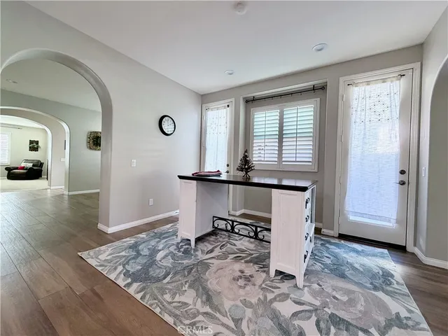a kitchen with granite countertop a sink and cabinets