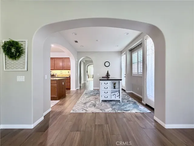 a bedroom with a bed and a ceiling fan