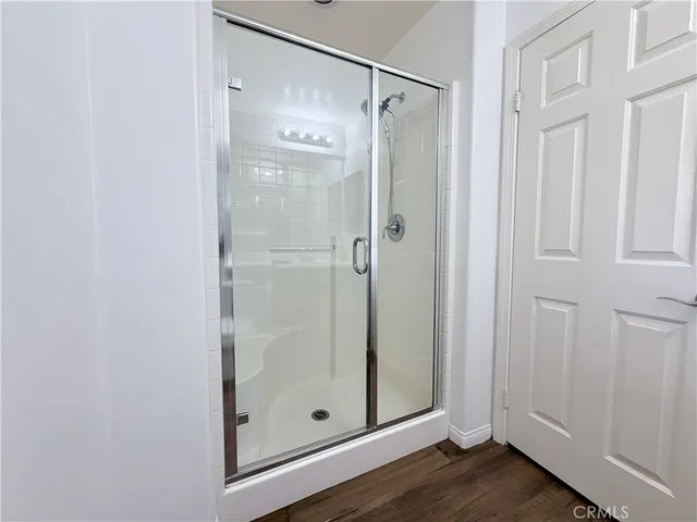 a white toilet sitting next to a bath tub