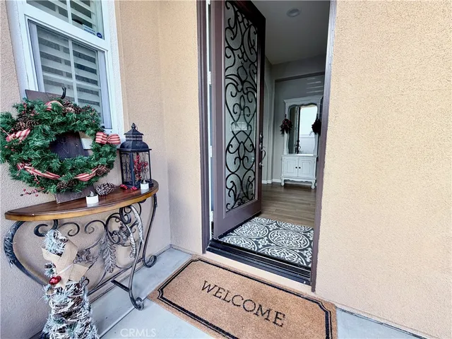 a walk in closet room with wooden floor