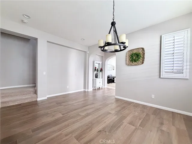 a kitchen with stainless steel appliances granite countertop a refrigerator and a stove