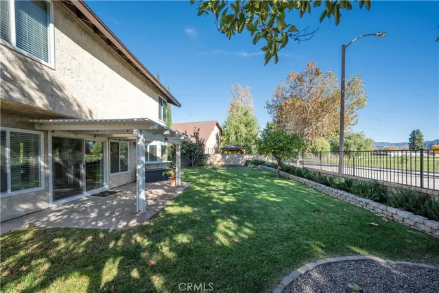 a view of a house with backyard porch and garden