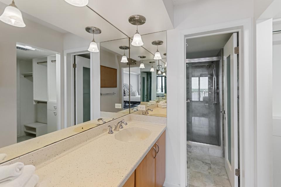 136 Lakeshore Drive, Unit PH10 North Palm Beach, FL 33408 - Photo 19 of 38 a bathroom with a sink and a mirror