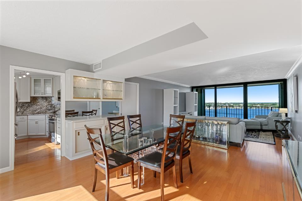 136 Lakeshore Drive, Unit PH10 North Palm Beach, FL 33408 - Photo 2 of 38 a dining room with furniture and wooden floor