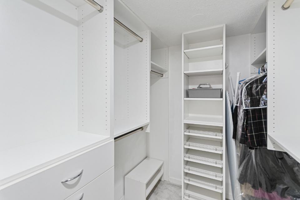136 Lakeshore Drive, Unit PH10 North Palm Beach, FL 33408 - Photo 21 of 38 a view of walk in closet with empty racks