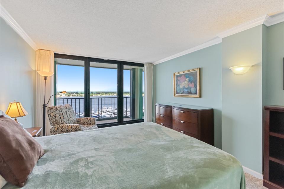 136 Lakeshore Drive, Unit PH10 North Palm Beach, FL 33408 - Photo 24 of 38 a bedroom with a large bed and a large window