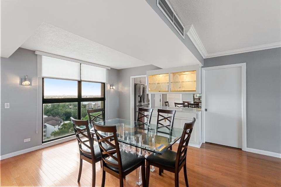 136 Lakeshore Drive, Unit PH10 North Palm Beach, FL 33408 - Photo 3 of 38 a dining room with furniture and window
