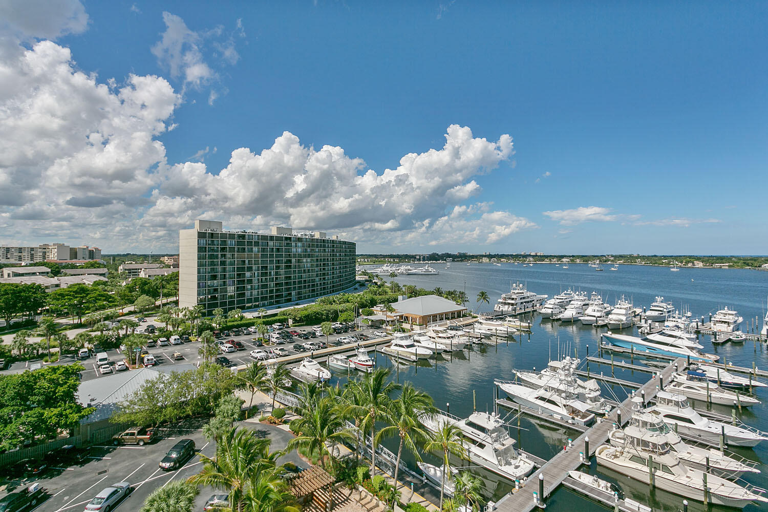 136 Lakeshore Drive, Unit PH10 North Palm Beach, FL 33408 - Photo 38 of 38 a view of a lake with lawn chairs
