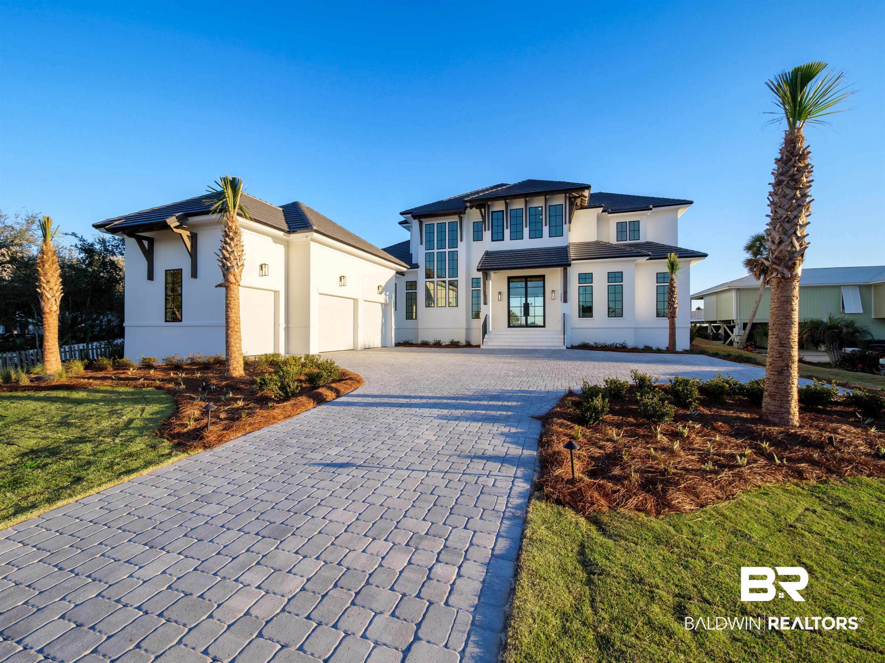 31292 River Road Orange Beach, AL 36561 - Photo 1 of 48 View of front of home with decorative driveway and stucco siding