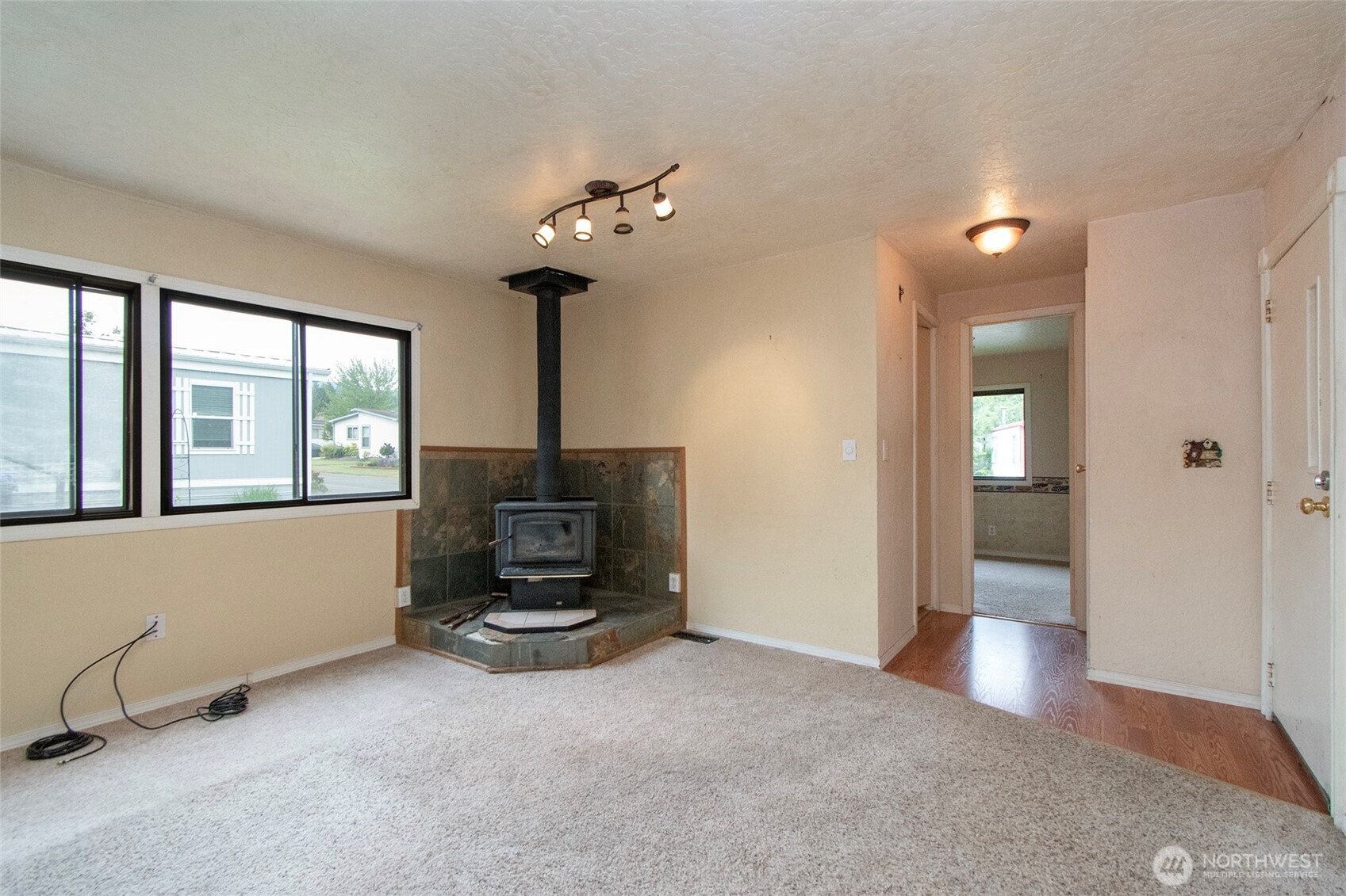 90 Baywood Village Road, Unit 34 Sequim, WA 98382 - Photo 7 of 40 wooden floor in an empty room with a window