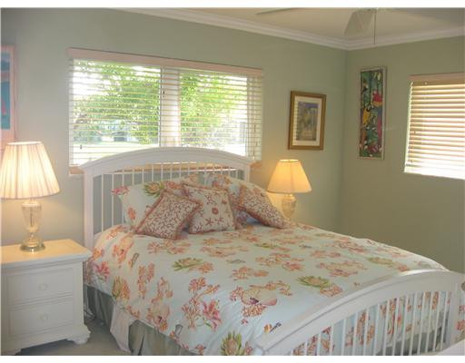 3931 Northeast 31st Avenue Lighthouse Point, FL 33064 - Photo 11 of 16 a bedroom with a bed and a window
