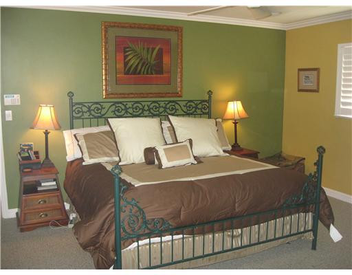 3931 Northeast 31st Avenue Lighthouse Point, FL 33064 - Photo 9 of 16 a bedroom with a bed and wall painting