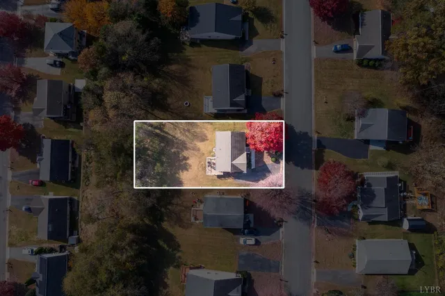 an outdoor space with seating area and small garden