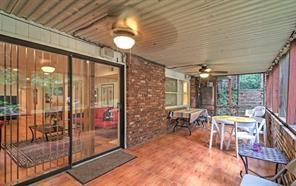 843 Artwood Road Northeast, Unit 843 Atlanta, GA 30307 - Photo 14 of 18 a view of a dining room with furniture wooden floor and chandelier