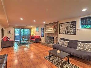 843 Artwood Road Northeast, Unit 843 Atlanta, GA 30307 - Photo 18 of 18 a living room with furniture and a fireplace