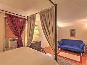 a view of a living room with furniture and a window