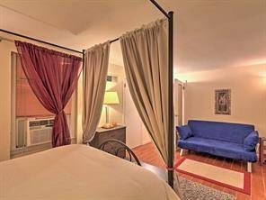 843 Artwood Road Northeast, Unit 843 Atlanta, GA 30307 - Photo 9 of 18 a view of a living room with furniture and a window