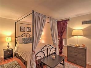 843 Artwood Road Northeast, Unit 843 Atlanta, GA 30307 - Photo 10 of 18 a bedroom with a bed and a table