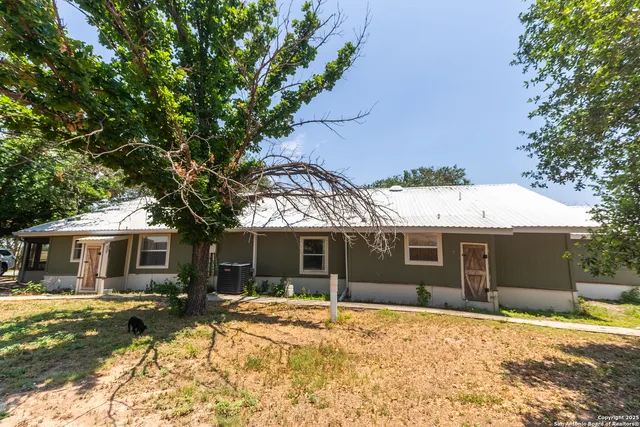 a house with trees in front of it
