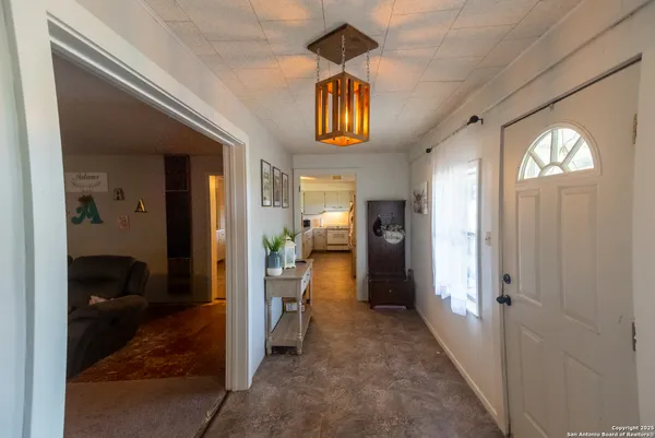 a view of a hallway view with wooden floor and bedroom