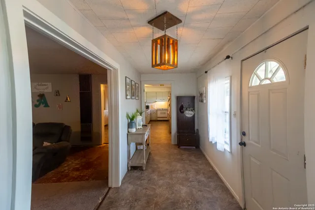 a view of a hallway view with wooden floor and bedroom