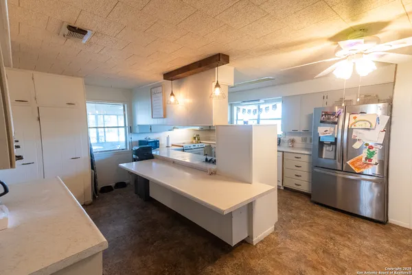 a room with refrigerator and window