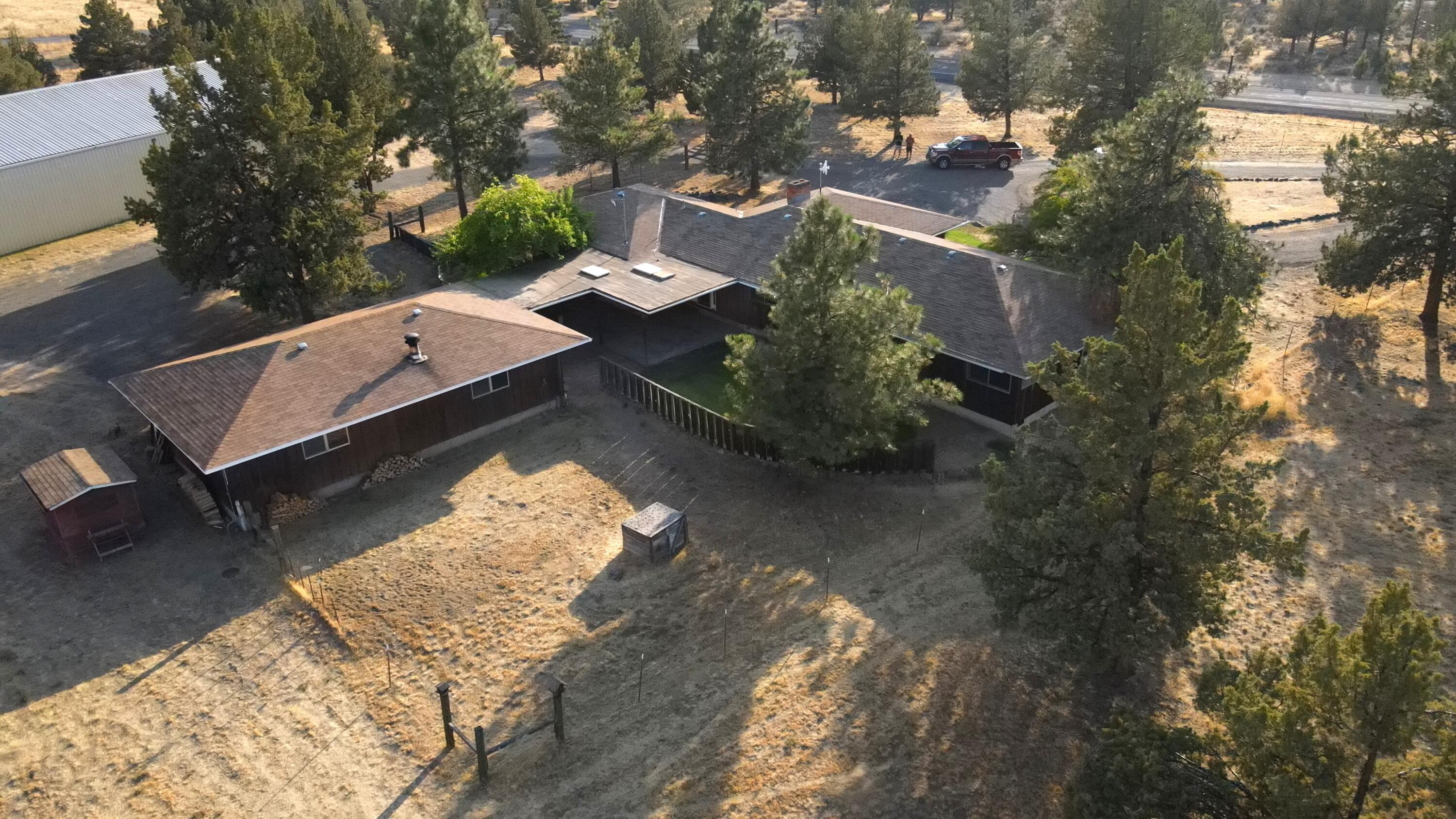 6302 Stillman Road Powell Butte, OR 97753 - Photo 36 of 39 an aerial view of a house with yard swimming pool and outdoor seating