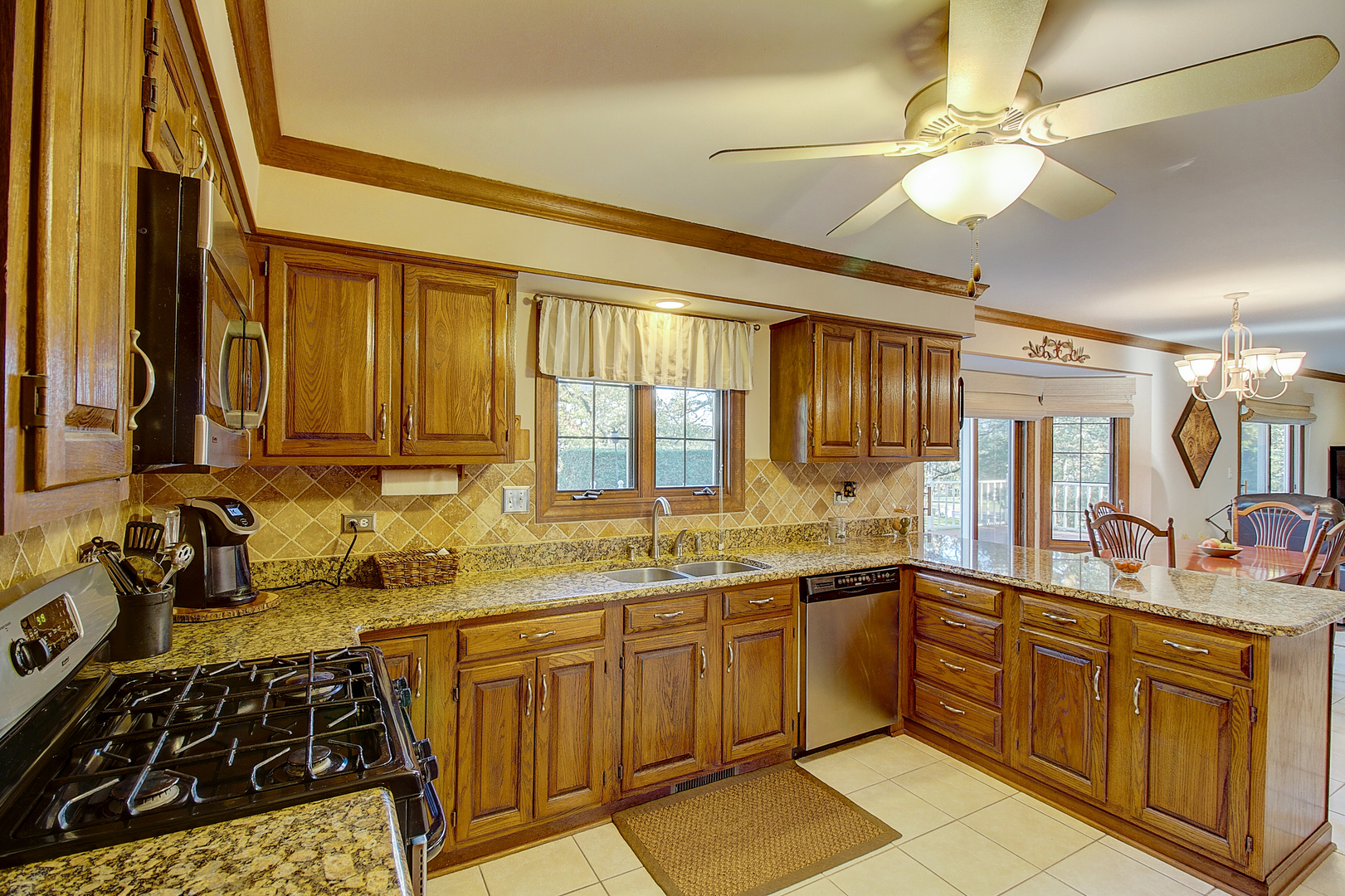 35W522 Miller Road Algonquin, IL 60102 - Photo 11 of 63 a kitchen with a sink stove and cabinets