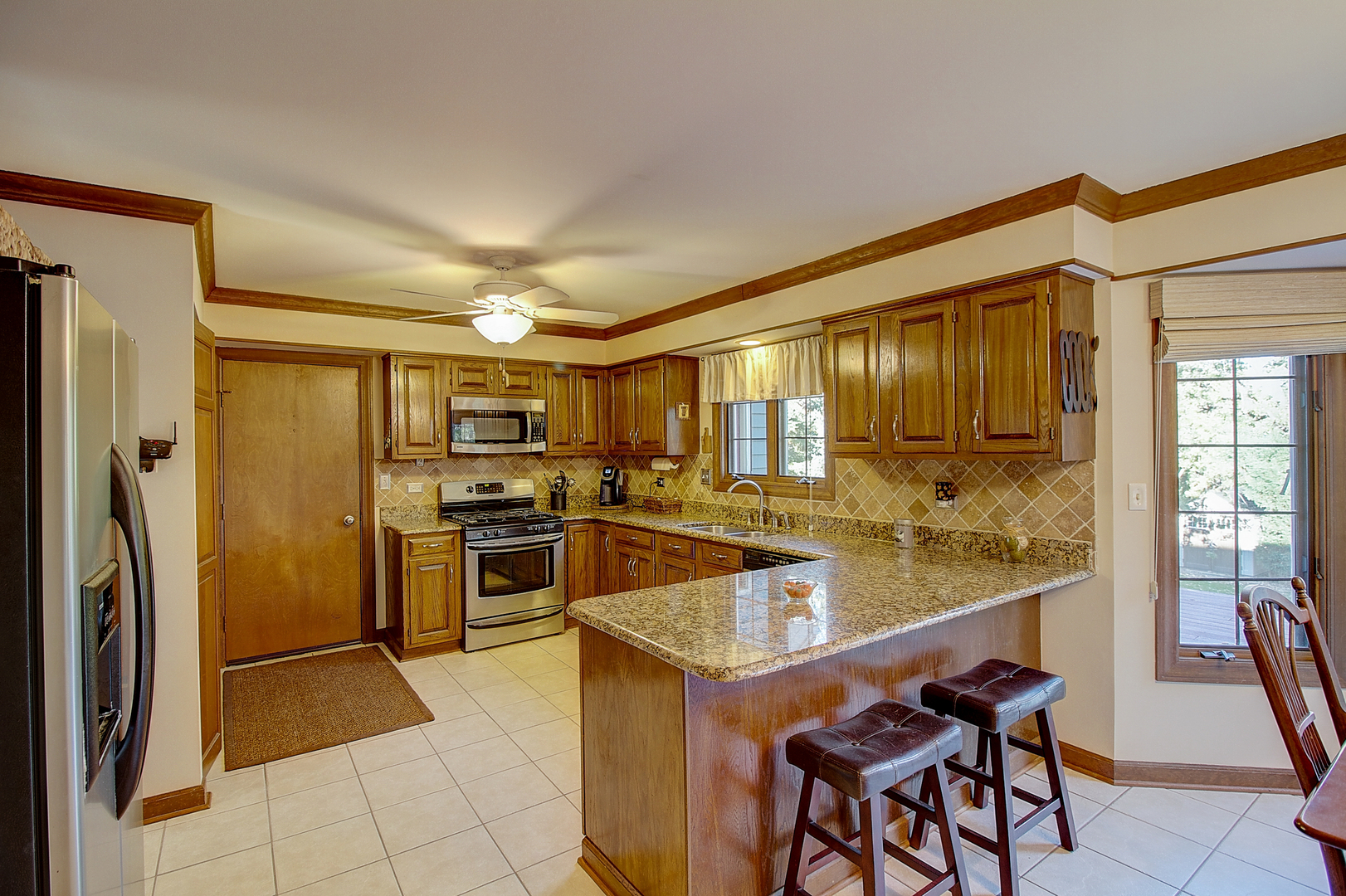 35W522 Miller Road Algonquin, IL 60102 - Photo 15 of 63 a kitchen with stainless steel appliances granite countertop a refrigerator and a stove top oven