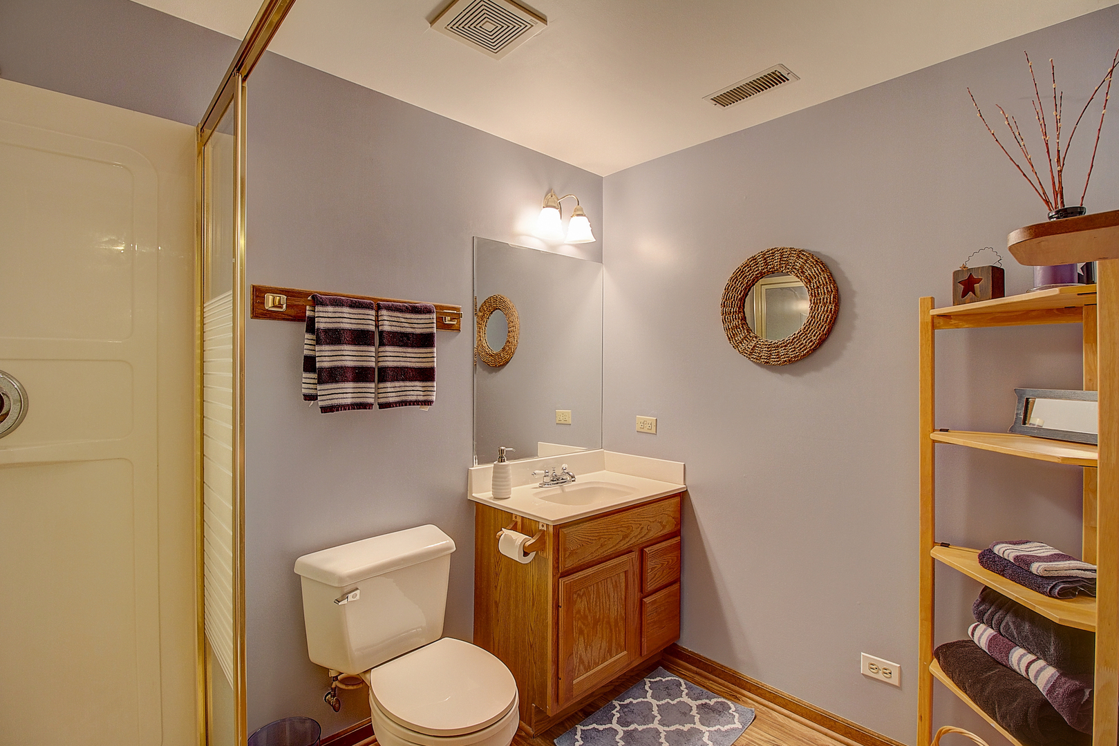 35W522 Miller Road Algonquin, IL 60102 - Photo 21 of 63 a bathroom with a toilet sink vanity and mirror