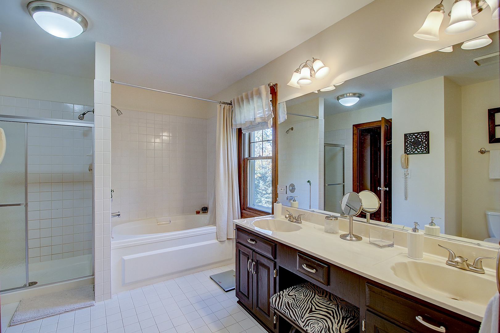 35W522 Miller Road Algonquin, IL 60102 - Photo 25 of 63 a bathroom with a tub double sink and a mirror