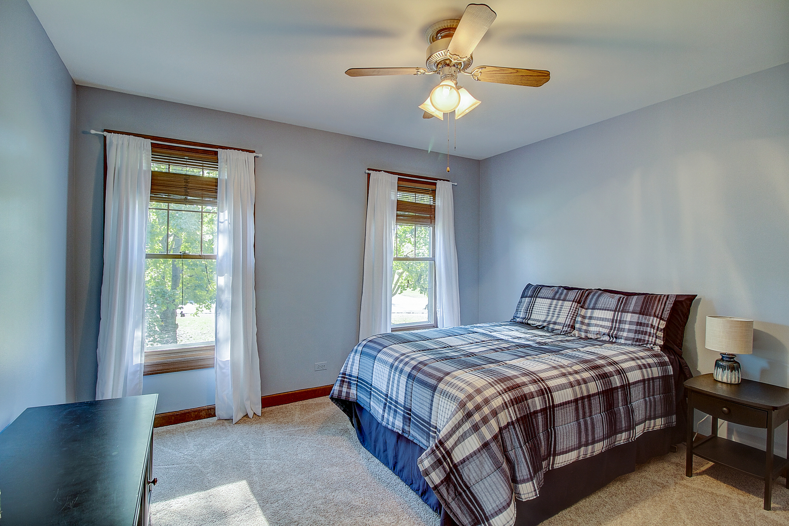 35W522 Miller Road Algonquin, IL 60102 - Photo 26 of 63 a bedroom with a bed and a chandelier