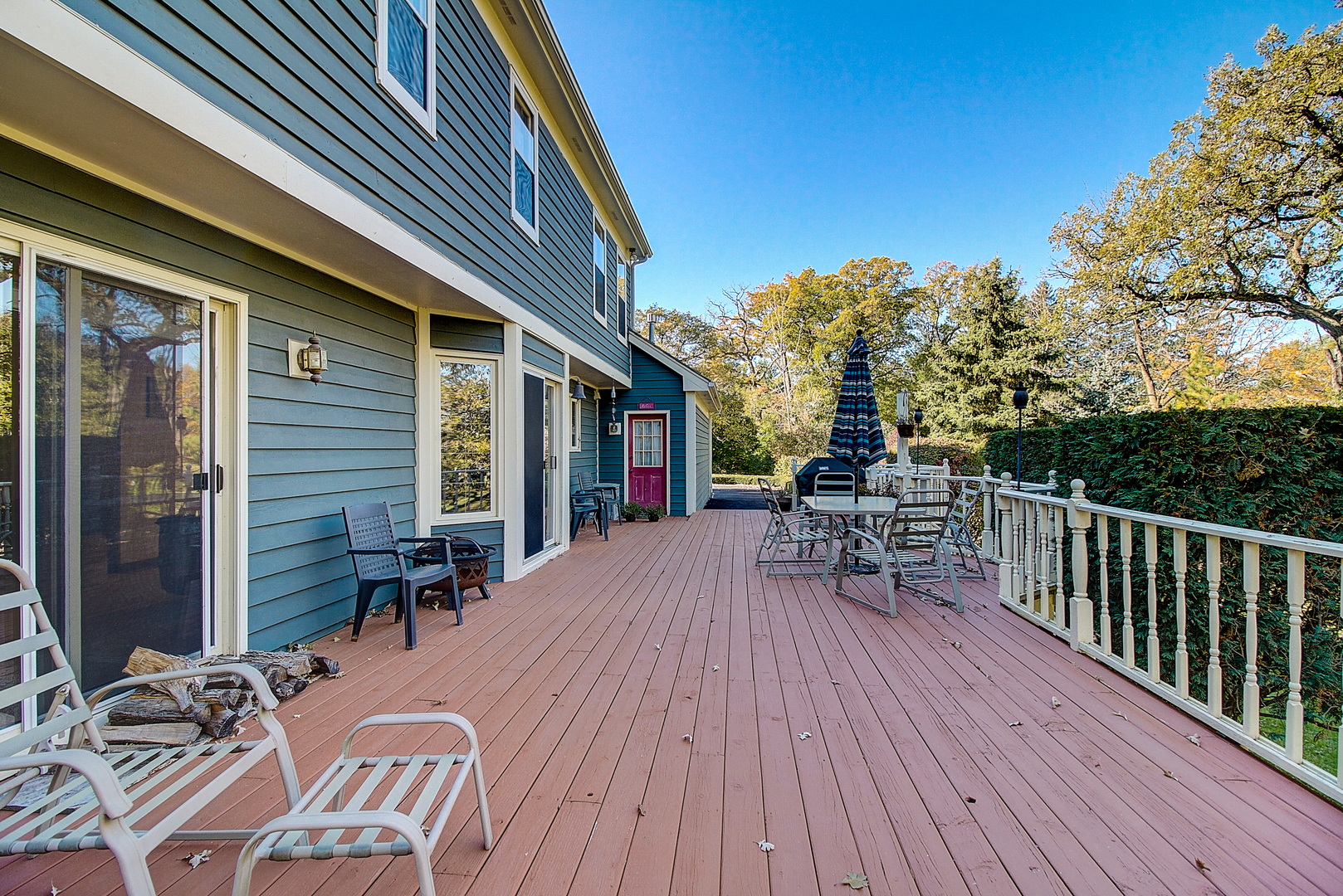 35W522 Miller Road Algonquin, IL 60102 - Photo 43 of 63 a view of a patio with table and chairs with wooden floor and fence