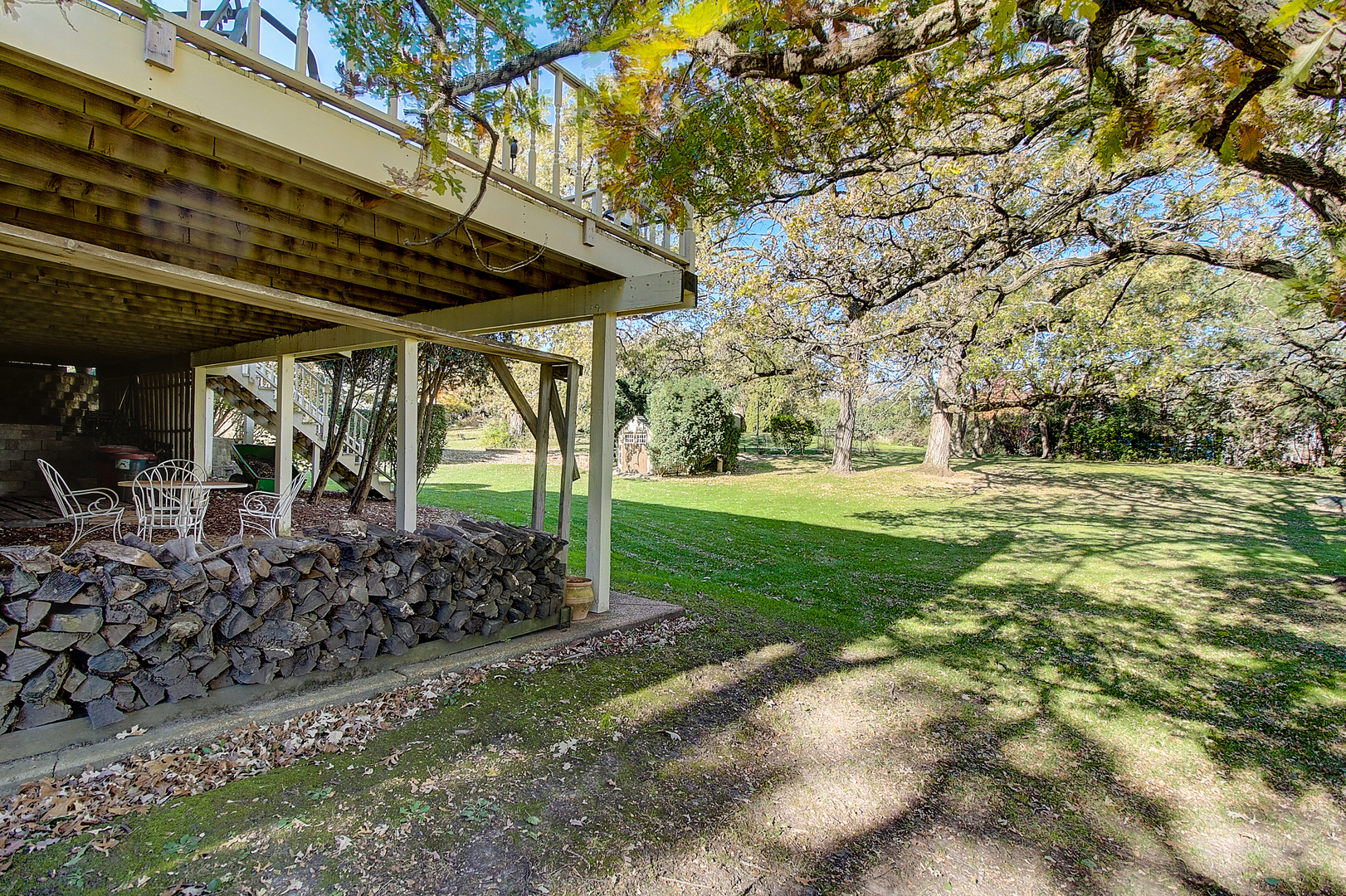 35W522 Miller Road Algonquin, IL 60102 - Photo 49 of 63 a view of a patio with table and chairs under an umbrella
