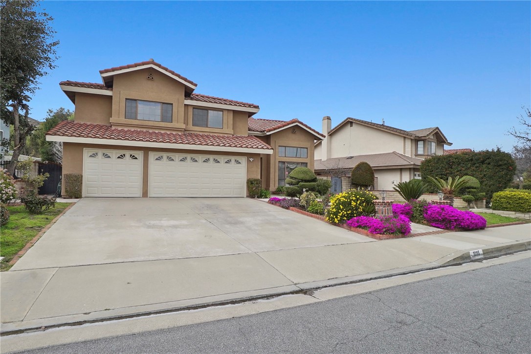 a front view of a house with yard