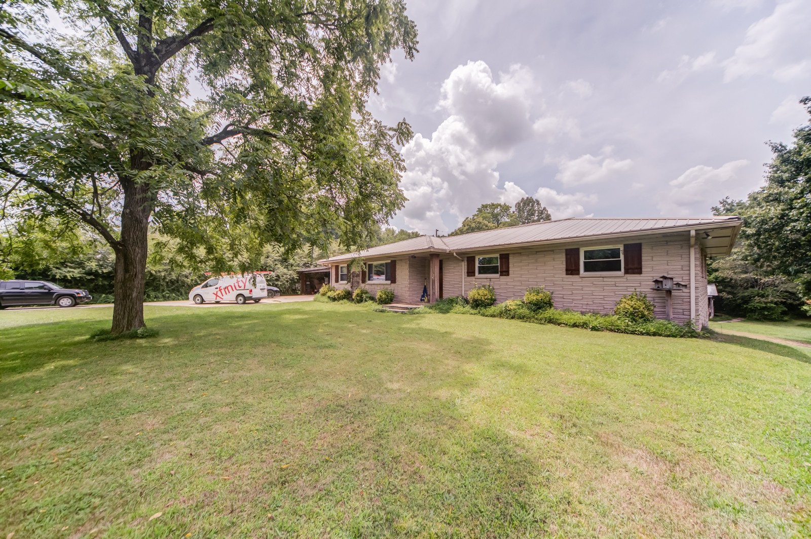 1353 Academy Road Portland, TN 37148 - Photo 1 of 35 a front view of house with yard and trees