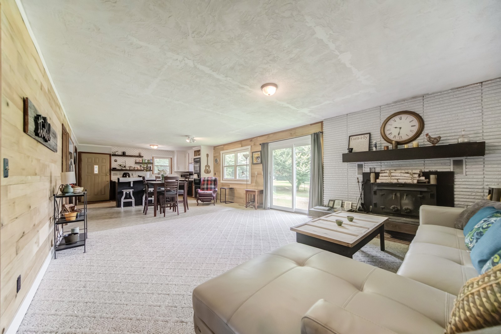 1353 Academy Road Portland, TN 37148 - Photo 15 of 35 a living room with furniture a clock and a large window