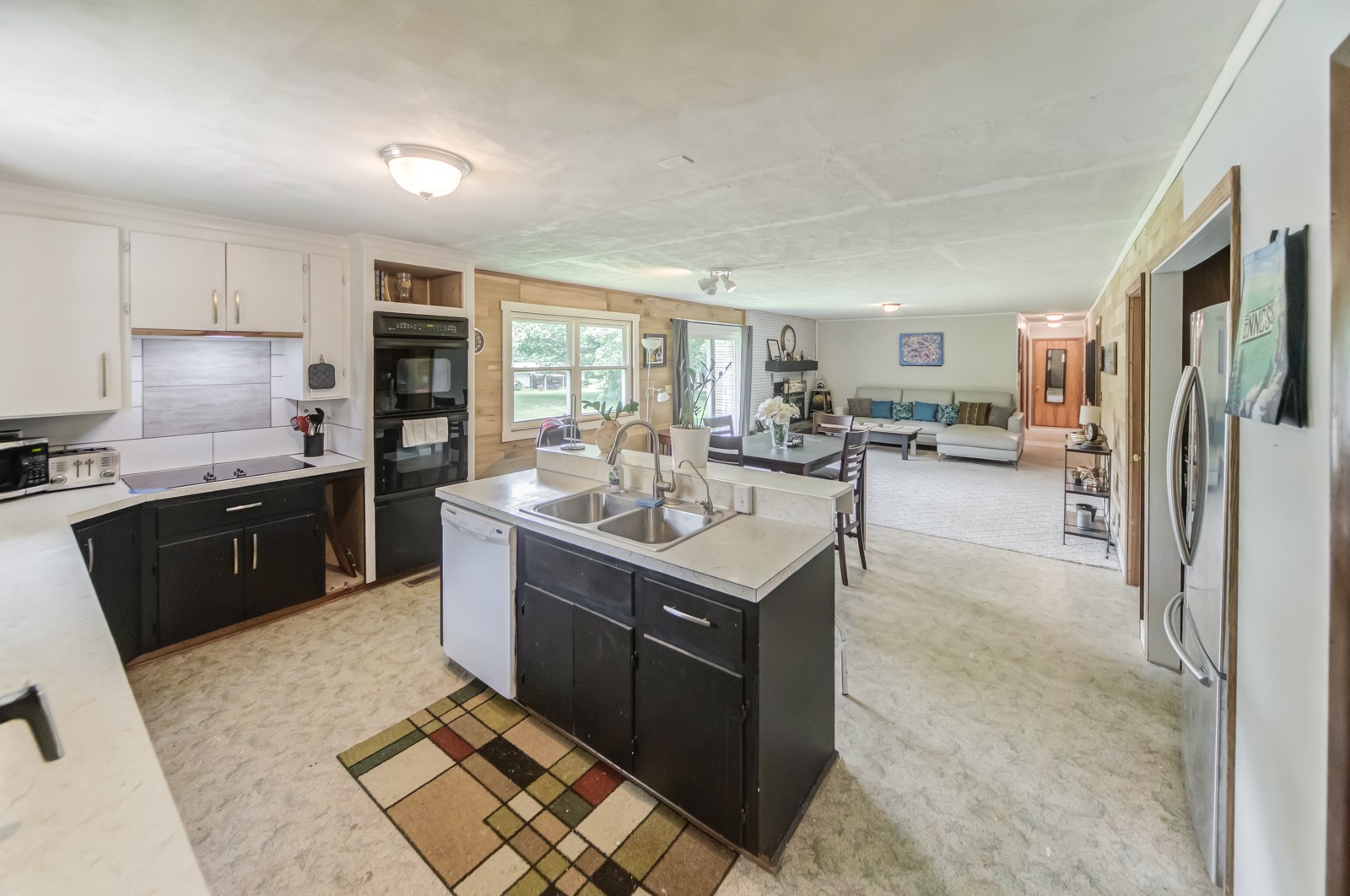 1353 Academy Road Portland, TN 37148 - Photo 16 of 35 a kitchen with a sink stove and refrigerator