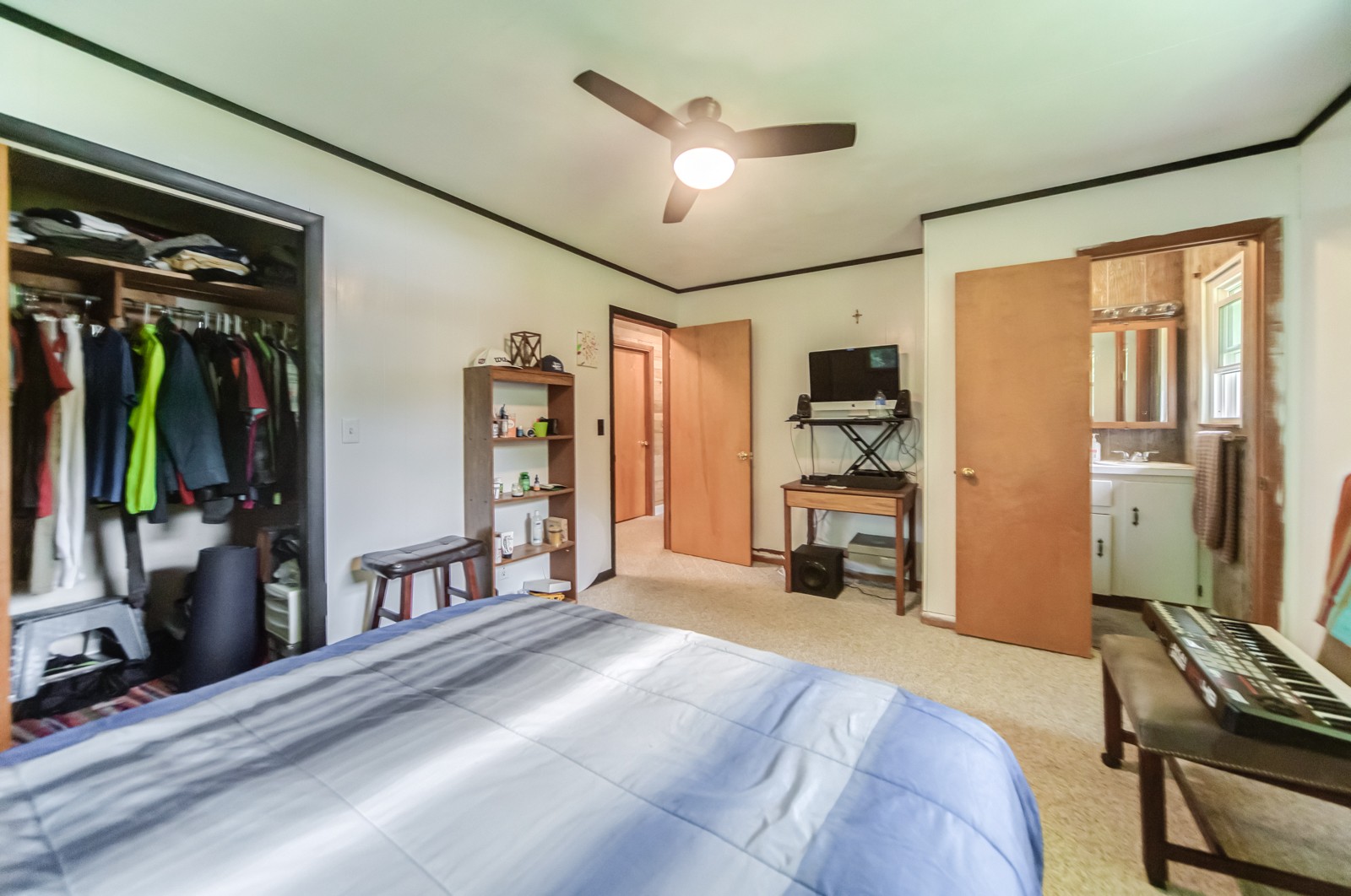 1353 Academy Road Portland, TN 37148 - Photo 20 of 35 a bedroom with a bed and a flat tv screen