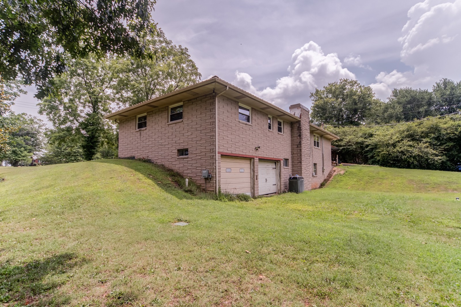 1353 Academy Road Portland, TN 37148 - Photo 24 of 35 a view of a house with a yard and large tree