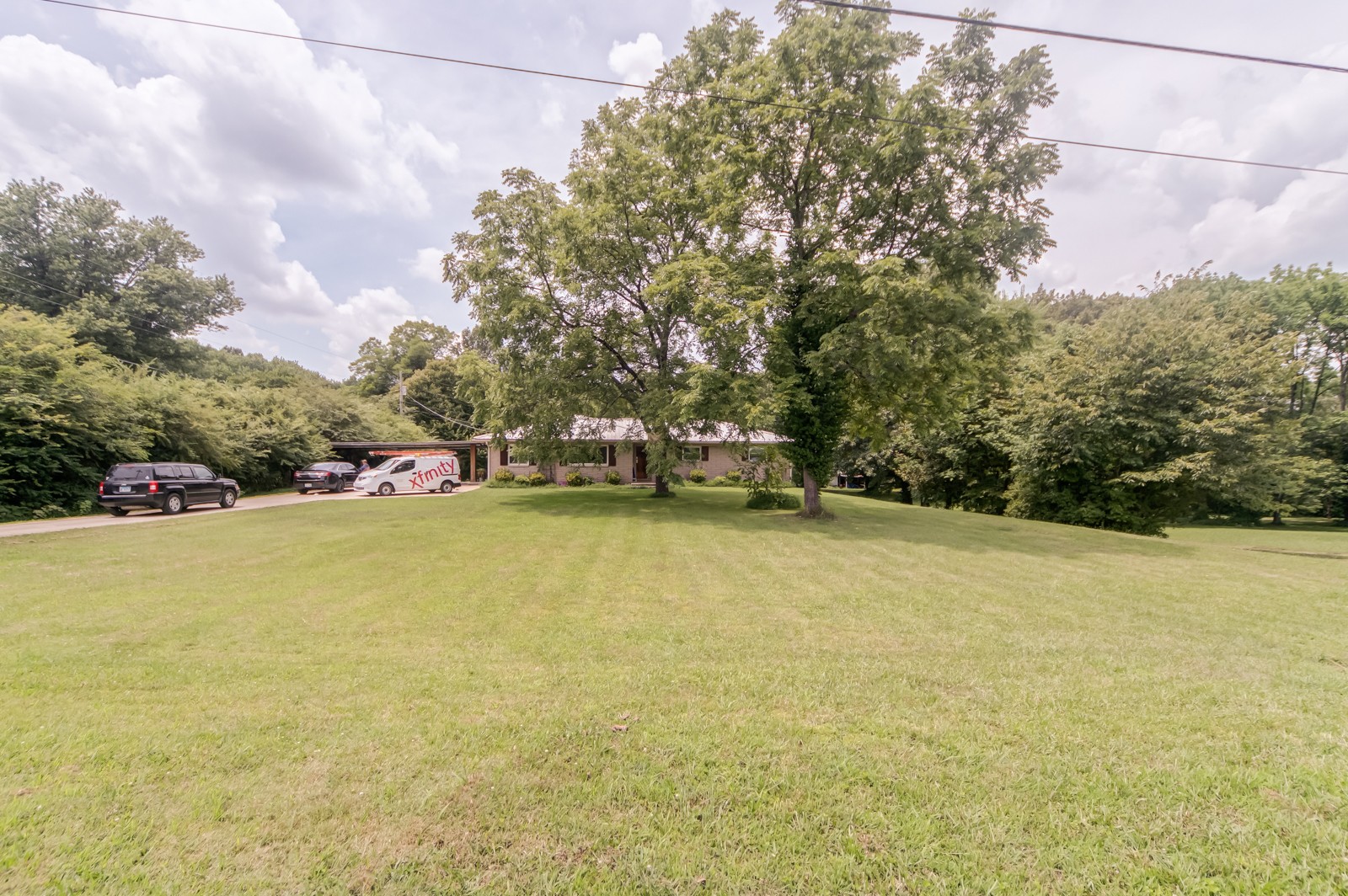 1353 Academy Road Portland, TN 37148 - Photo 27 of 35 a view of a swimming pool and trees in the background