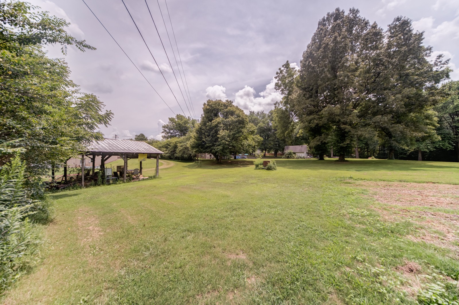 1353 Academy Road Portland, TN 37148 - Photo 30 of 35 a view of a swimming pool and trees in the background