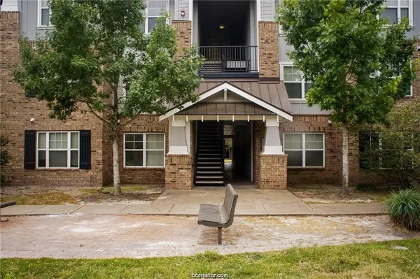 a front view of a house with garage
